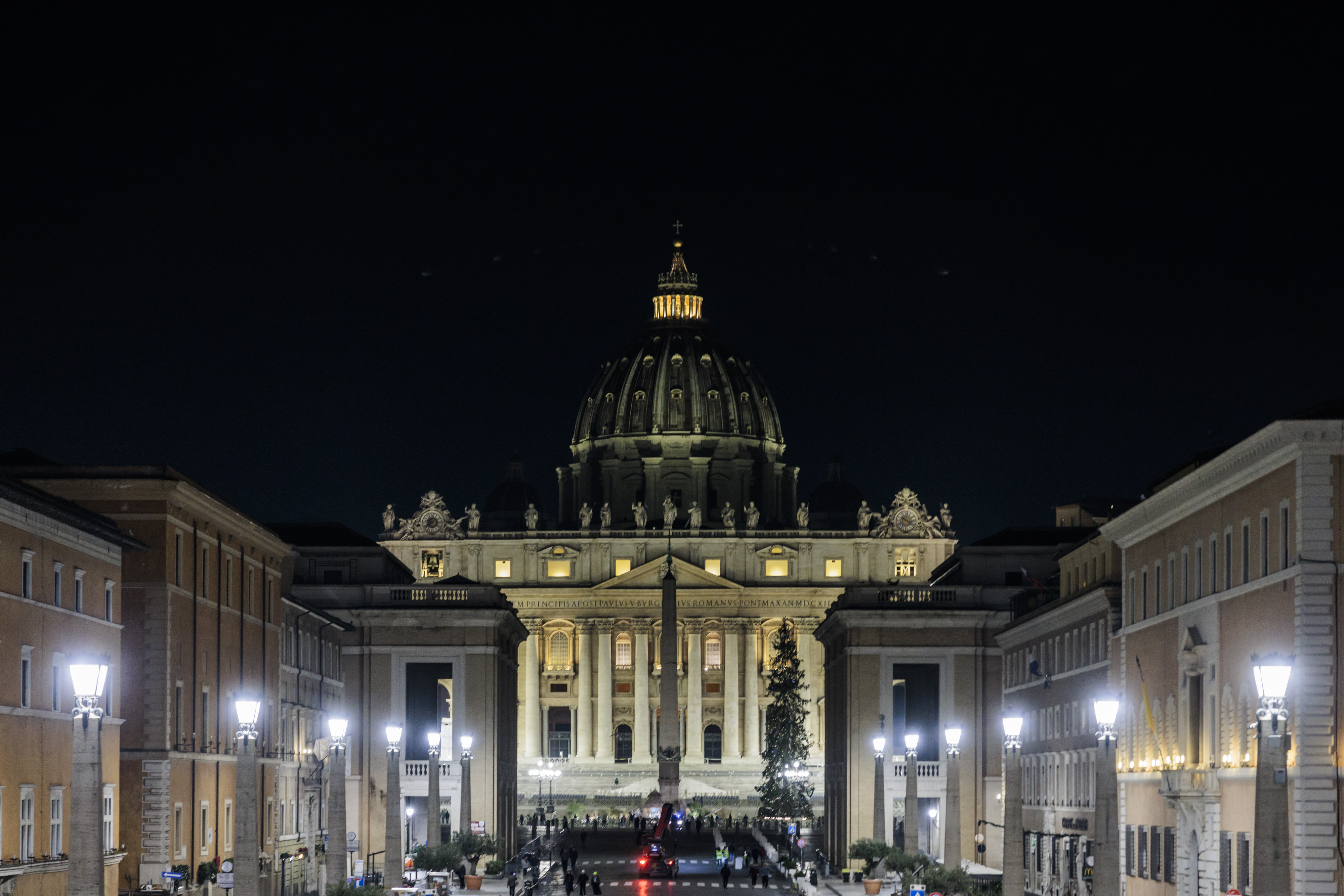 Street lamps in Via della Conciliazione and St. Peter's Basilica illuminated