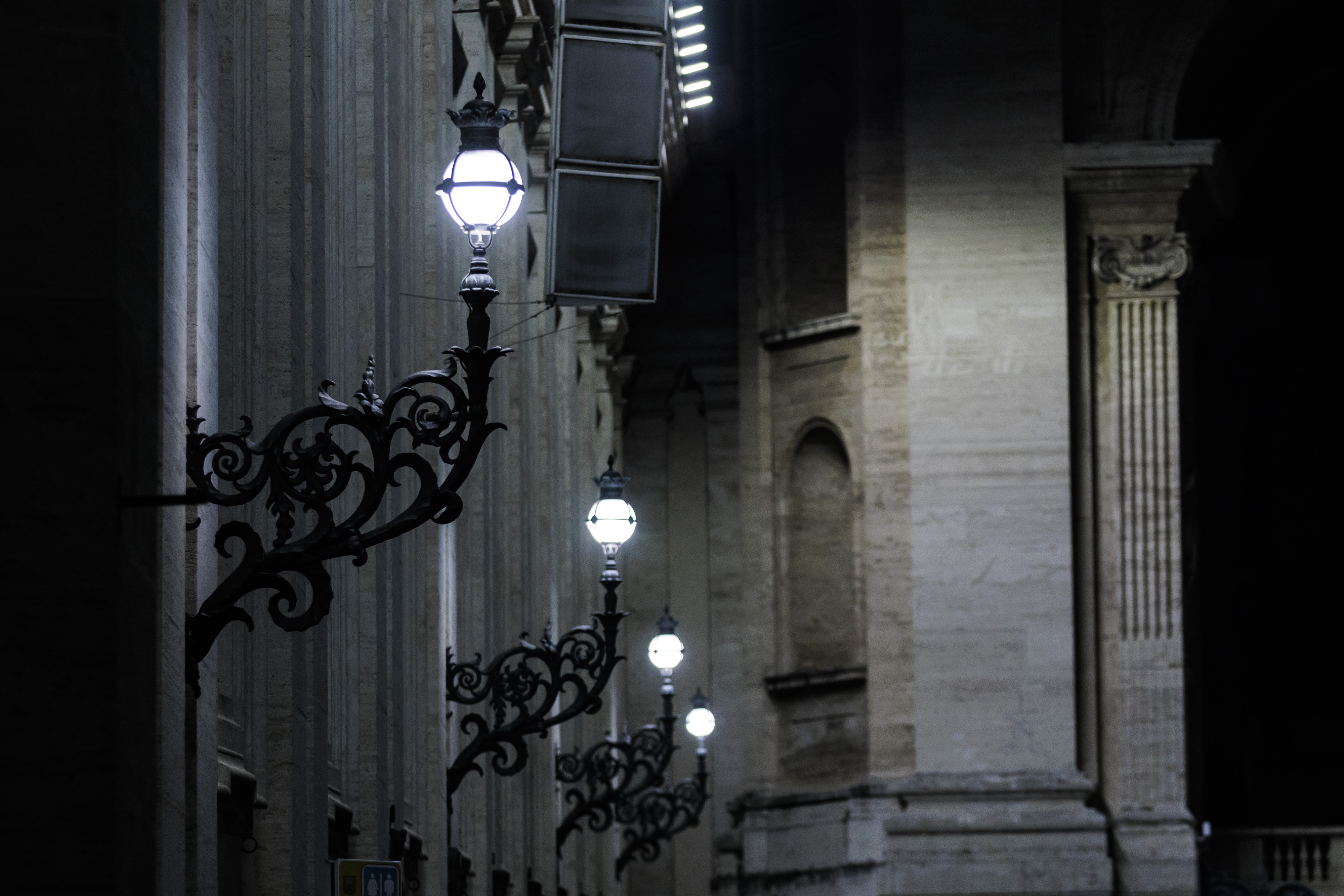 Some illuminated street lamps in Via della Conciliazione