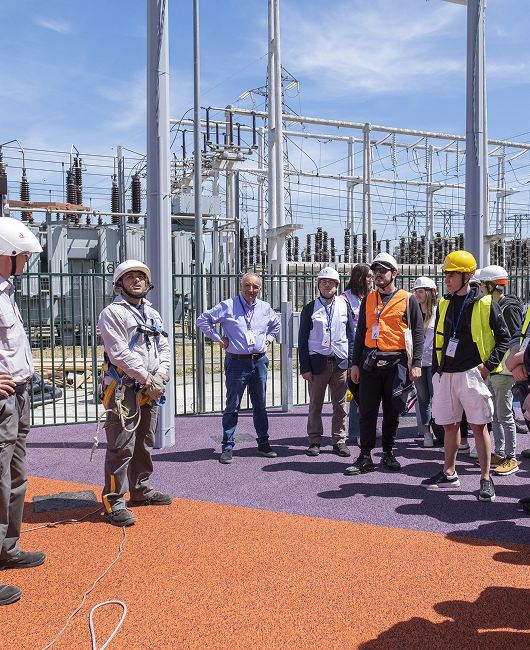 Workers with protective helmets during a health and safety training day