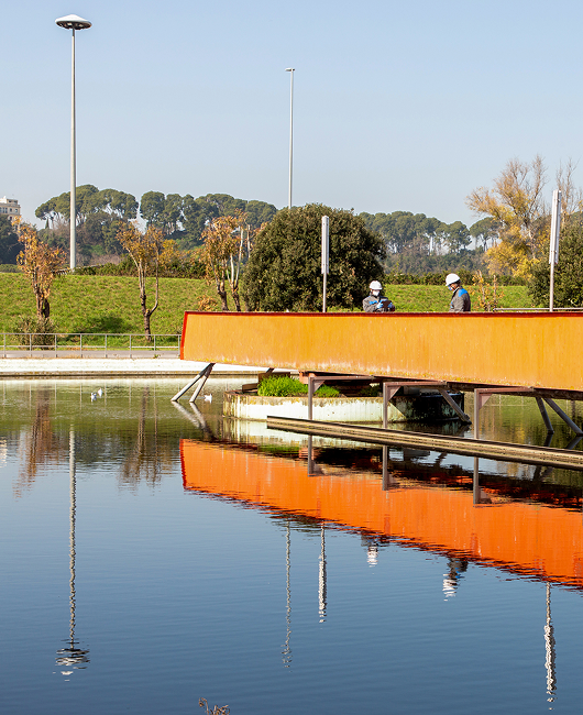 Two workers on a bridge at the Rome North water treatment plant
